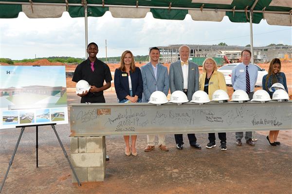 Participating in the MHS Topping Out Ceremony with students and community leaders